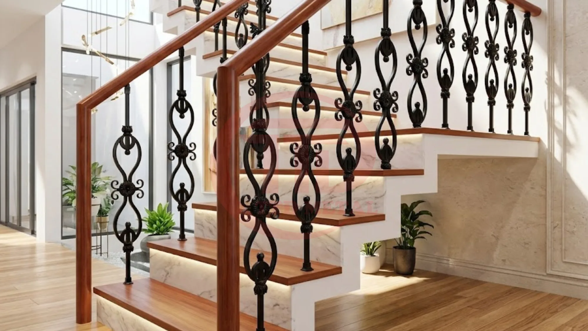 Interior iron stair railing design example with ornamental balusters and wood-tone handrail